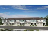 Beautiful townhome featuring a private garage and landscaped front yard at 15164 Cuzcorro Ct, Nokomis, FL 34275