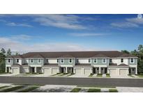 Attractive new townhomes with attached garages and manicured landscaping create excellent curb appeal at 15176 Cuzcorro Ct, Nokomis, FL 34275