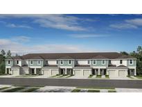 New townhome community showcasing multi-story units with attached garages and manicured lawns at 15184 Cuzcorro Ct, Nokomis, FL 34275