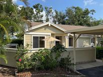 Charming single-story home showcasing well-maintained landscaping and a welcoming front facade at 3002 Sail Pointe Cir # 1B, Venice, FL 34293
