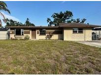 Charming single-story home with a well-maintained lawn and a classic exterior at 3715 Lokai, Sarasota, FL 34232