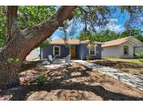 Charming home featuring a cozy front yard with a fire pit and comfortable seating area at 4542 19Th S Ave, St Petersburg, FL 33711