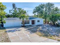 Charming single-story home features a well-manicured front yard and attached two-car garage, all freshly painted and inviting at 4907 4Th Avenue Nw Cir, Bradenton, FL 34209