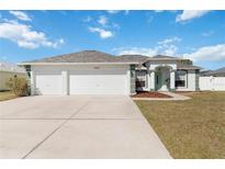Charming single-story home with a three-car garage and well-maintained landscaping at 5909 33Rd E Dr, Palmetto, FL 34221