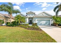 Charming one-story home featuring well-manicured landscaping and a welcoming two-car garage at 11508 Griffith Park Ter, Bradenton, FL 34211