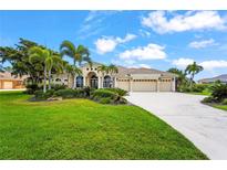 Inviting single-Gathering home with lush landscaping and a spacious three-car garage, perfect for luxury living at 6143 9Th Avenue Ne Cir, Bradenton, FL 34212