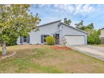Charming single-Gathering home featuring a well-maintained lawn and an attached two-car garage at 8160 Glenbrooke Ct, Sarasota, FL 34234
