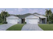 Charming two-story home with well-manicured lawn and driveway leading to a two-car garage at 18845 Dayspring Pl, Venice, FL 34293