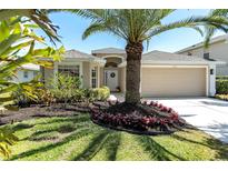 Charming single-story home with well-manicured landscaping and a two-car garage at 315 Heritage Isles Way, Bradenton, FL 34212