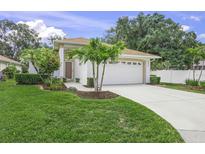 Charming single-story home with manicured lawn, lush landscaping and a two car garage at 3263 Woodberry Ln # Lot 15, Sarasota, FL 34231