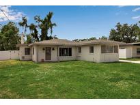 Charming single-story home featuring a well-maintained lawn and neutral-toned exterior at 417 20Th W Ave, Palmetto, FL 34221