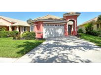 Charming single-Gathering home with a well-maintained lawn, lovely landscaping, and a two-car garage at 4322 Reflections Pkwy, Sarasota, FL 34233