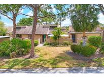 Charming townhouse with well-manicured landscaping, trees, and a private courtyard at 5273 Myrtle Wood # 37, Sarasota, FL 34235