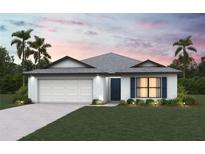 Charming single-story home with a manicured lawn, two-car garage, and tasteful landscaping at 5521 Colfax Ter, Port Charlotte, FL 33981