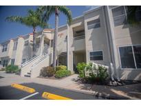 Inviting condo exterior featuring well-manicured landscaping and convenient parking at 6151 Bahia Del Mar Blvd # 123, St Petersburg, FL 33715