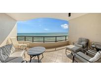 Inviting outdoor balcony with ocean views and comfortable seating at 435 L Ambiance Dr # K506, Longboat Key, FL 34228
