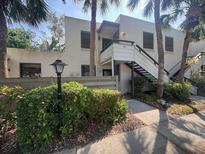 Inviting two-story condo with a private entrance and lush landscaping at 647 Woodlawn Dr # 647, Bradenton, FL 34210