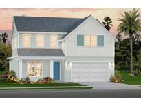 Charming two-story home featuring a two-car garage, tasteful landscaping and a welcoming light blue front door at 659 Maldives Trl, Sarasota, FL 34234