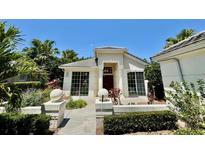 Charming single-story home featuring large windows and lush landscaping at 7330 Kensington Ct, University Park, FL 34201