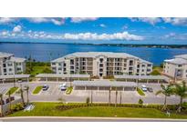 Beautiful condo building with waterfront views and covered parking spaces at 910 Tidewater Shores Loop # 103, Bradenton, FL 34208