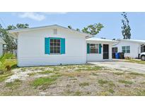Charming single-story home with colorful shutters and a freshly painted exterior at 920 Myrtle Ave, Venice, FL 34285