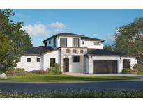 Beautiful two-story home featuring a stone facade, black trim windows, manicured lawn and dark garage door at 2485 S Milmar Dr, Sarasota, FL 34237