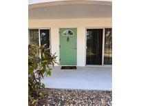 Charming green front door with sidelight windows welcomes you to this lovely home at 4035 S School Ave # D3, Sarasota, FL 34231