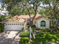 Charming single-story home boasts lush landscaping, a brick driveway, and a welcoming two-car garage at 6402 23Rd Avenue W Dr, Bradenton, FL 34209