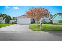 Charming home featuring well-maintained landscaping, paved driveway, and a welcoming two-car garage at 6909 34Th W Ave, Bradenton, FL 34209