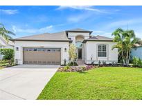 Charming single-Gathering home with a well-manicured lawn and two-car garage at 11367 Perico Isle Cir, Bradenton, FL 34209