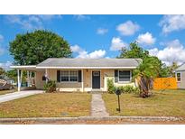 Charming single-story home with a covered carport, mailbox, and landscaped front yard at 2004 19Th W St, Bradenton, FL 34205