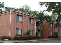 Two-story apartment building featuring a stucco exterior and manicured landscaping at 5310 26Th W St # 902, Bradenton, FL 34207