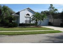 Charming single-story home with well-maintained landscaping and inviting curb appeal at 12301 Mosswood Pl, Lakewood Ranch, FL 34202