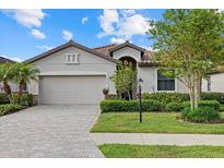 Charming single-story home with a two-car garage and lush landscaping in a well-maintained community at 17018 Blue Ridge Pl, Bradenton, FL 34211