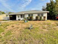 Charming single-story home featuring a covered carport, and a simple yard at 1905 Yale Ave, Bradenton, FL 34207