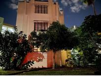 Charming vintage building featuring detailed architectural design and lush landscaping at 210 N 17Th W St # 15, Bradenton, FL 34205
