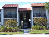 Charming condo with red tile roof, private balcony, and well-maintained landscaping in a desirable community at 3269 Beneva Rd # 203, Sarasota, FL 34232