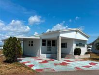 Charming single-story home with a covered entrance and cozy front yard, perfect for relaxed living at 237 Blackburn Blvd, North Port, FL 34287