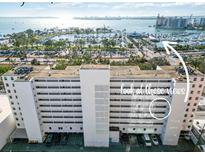 Condo building with parking and harbor views at 33 S Gulfstream Ave # 502, Sarasota, FL 34236