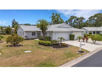 Charming single-story home featuring a well-maintained lawn, mature landscaping, and an attached two-car garage at 3666 Bonaventure Ct, Sarasota, FL 34243