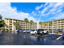 Apartment building featuring palm trees in the parking lot at 3740 Lake Bayshore Dr # Bldg K, Bradenton, FL 34205
