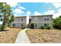 Beautiful two-story building with well-maintained landscaping and inviting walkway at 383 Bobby Jones Rd # 383, Sarasota, FL 34232