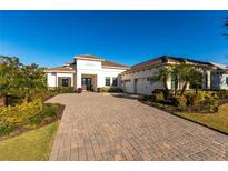 Beautiful single-Gathering home with a paver driveway and a well-manicured lawn in a desirable neighborhood at 7208 Prestbury Cir, Bradenton, FL 34202