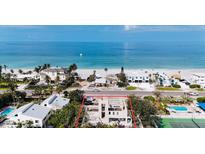 Stunning beachside property with modern architecture, showcasing panoramic ocean views at 2944 Gulf Of Mexico Dr, Longboat Key, FL 34228