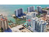 Stunning aerial view of a waterfront condo with beautiful ocean views and building amenities at 301 Quay Commons Dr # 1711, Sarasota, FL 34236