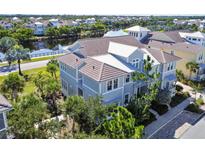 Beautiful two-story home with tropical landscaping and a view of the lake at 311 Compass Point Dr # 101, Bradenton, FL 34209