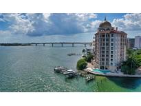 Stunning waterfront condo building with private boat docks and beautiful coastal views of the bay at 420 Golden Gate Pt # 200A, Sarasota, FL 34236