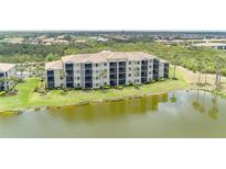 Beautiful condominium complex with lake views and lush landscaping at 7005 River Hammock Dr # 204, Bradenton, FL 34212
