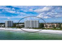 Breathtaking aerial view of beachfront condo with white sand and turquoise water at 2425 Gulf Of Mexico Dr # 6A, Longboat Key, FL 34228