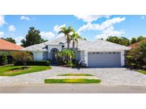 Beautiful single story home with landscaped front yard and brick paved driveway at 4239 Corso Venetia Blvd, Venice, FL 34293